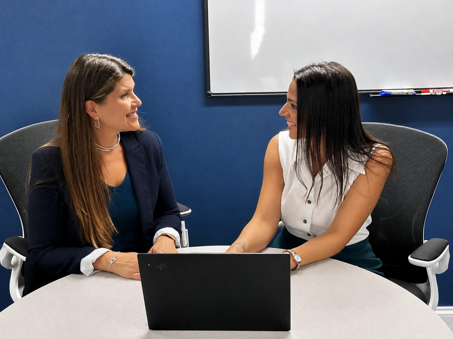 3rd Element team members in conversation about a client's IT environment.