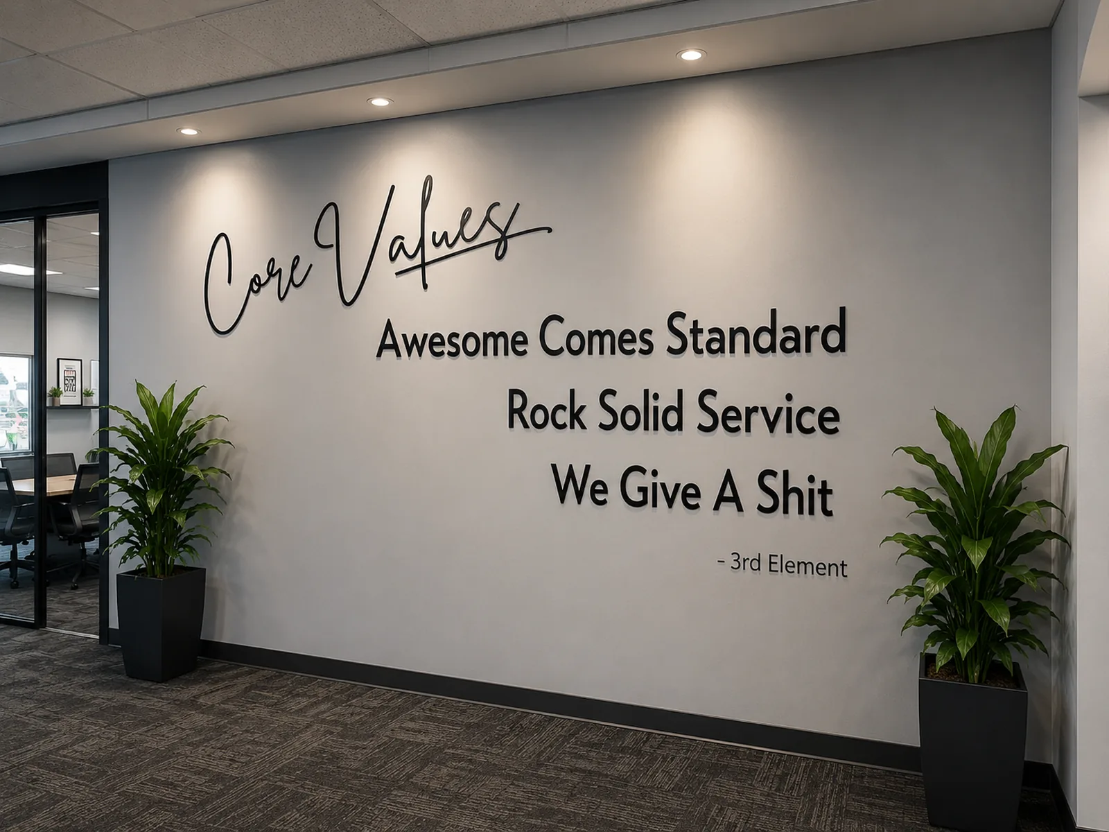 3rd Element office wall displaying core values: Awesome Comes Standard, Rock Solid Service, We Give A Shit.