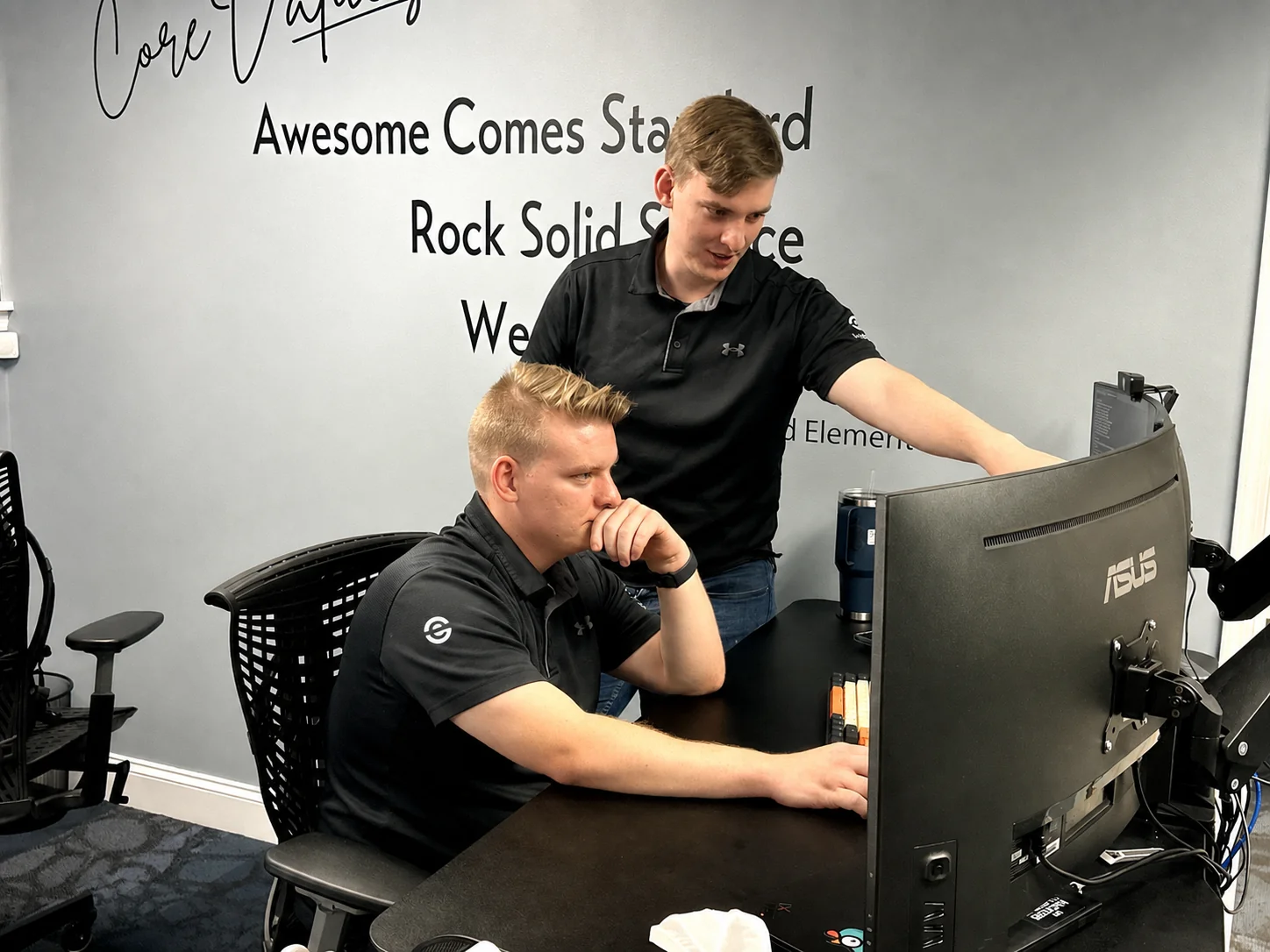 Two 3rd Element technicians reviewing backup and recovery status together.